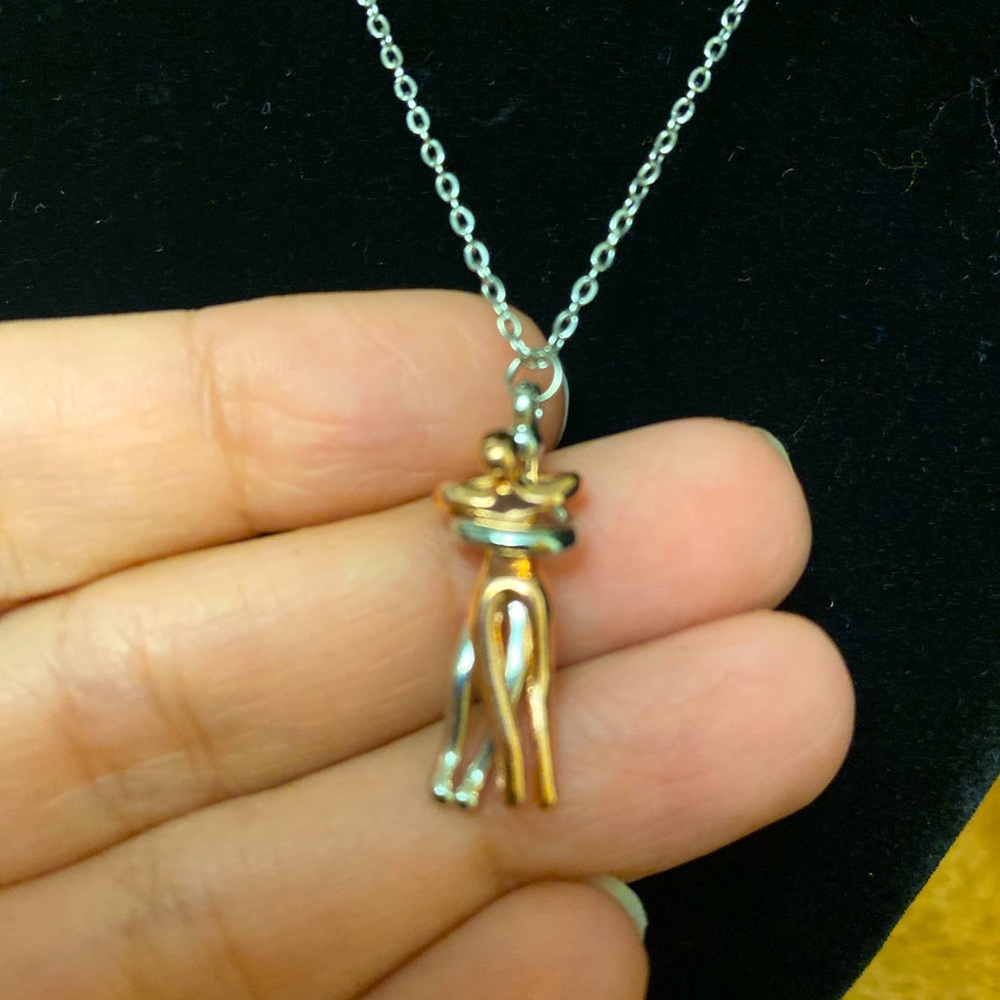 Couple embrace necklace